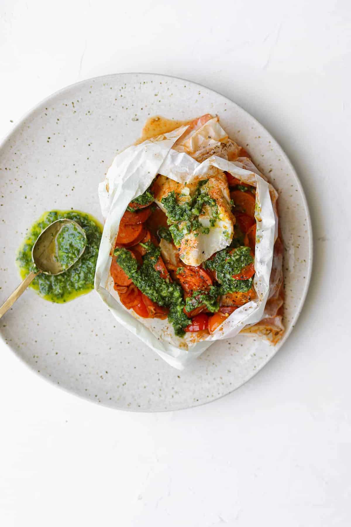 Cod cooked in parchment paper with chorizo and tomatoes