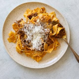 Short Rib Ragu with Pappardelle on a plate with a spoon