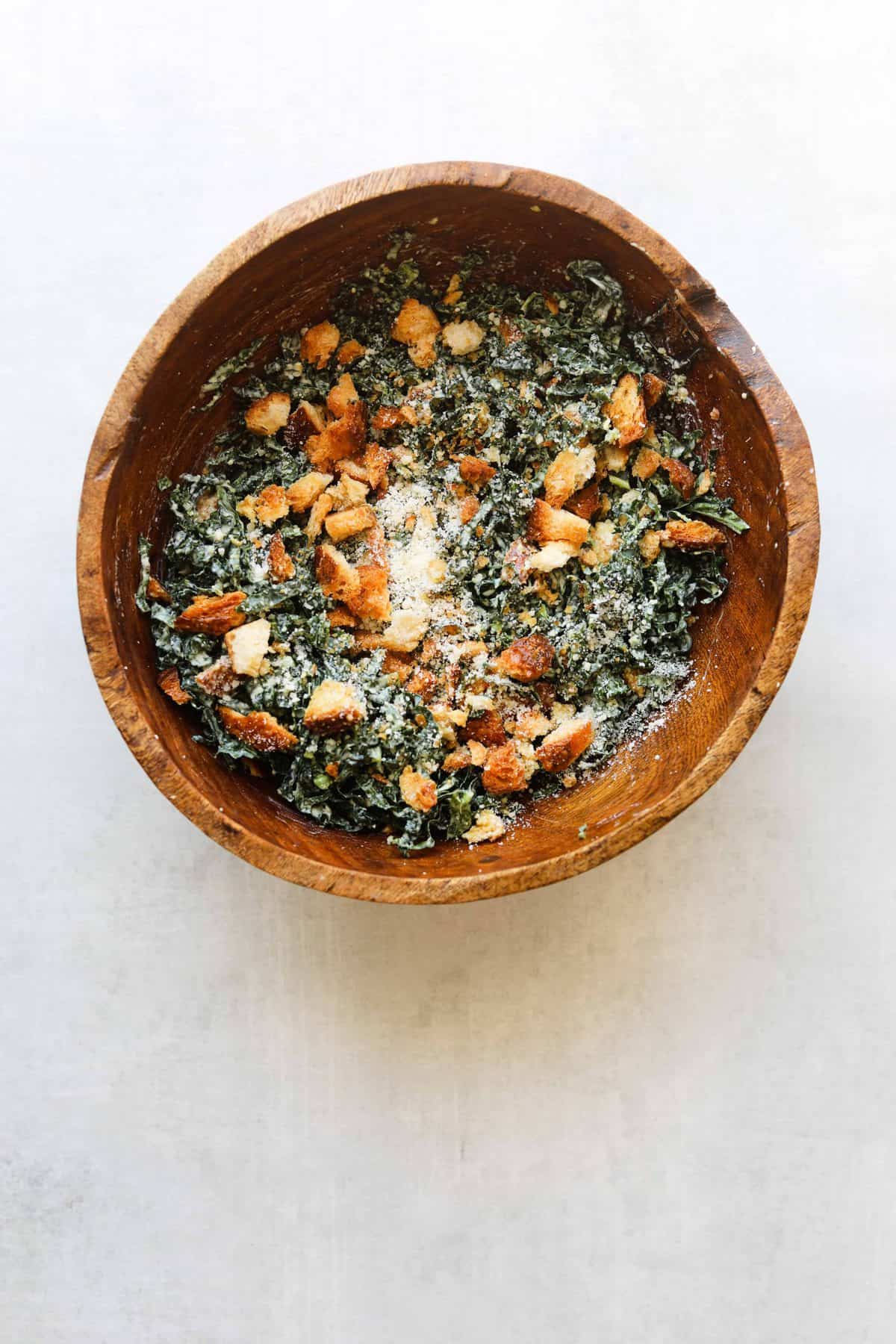 The Perfect Kale Caesar Salad in a wooden bowl