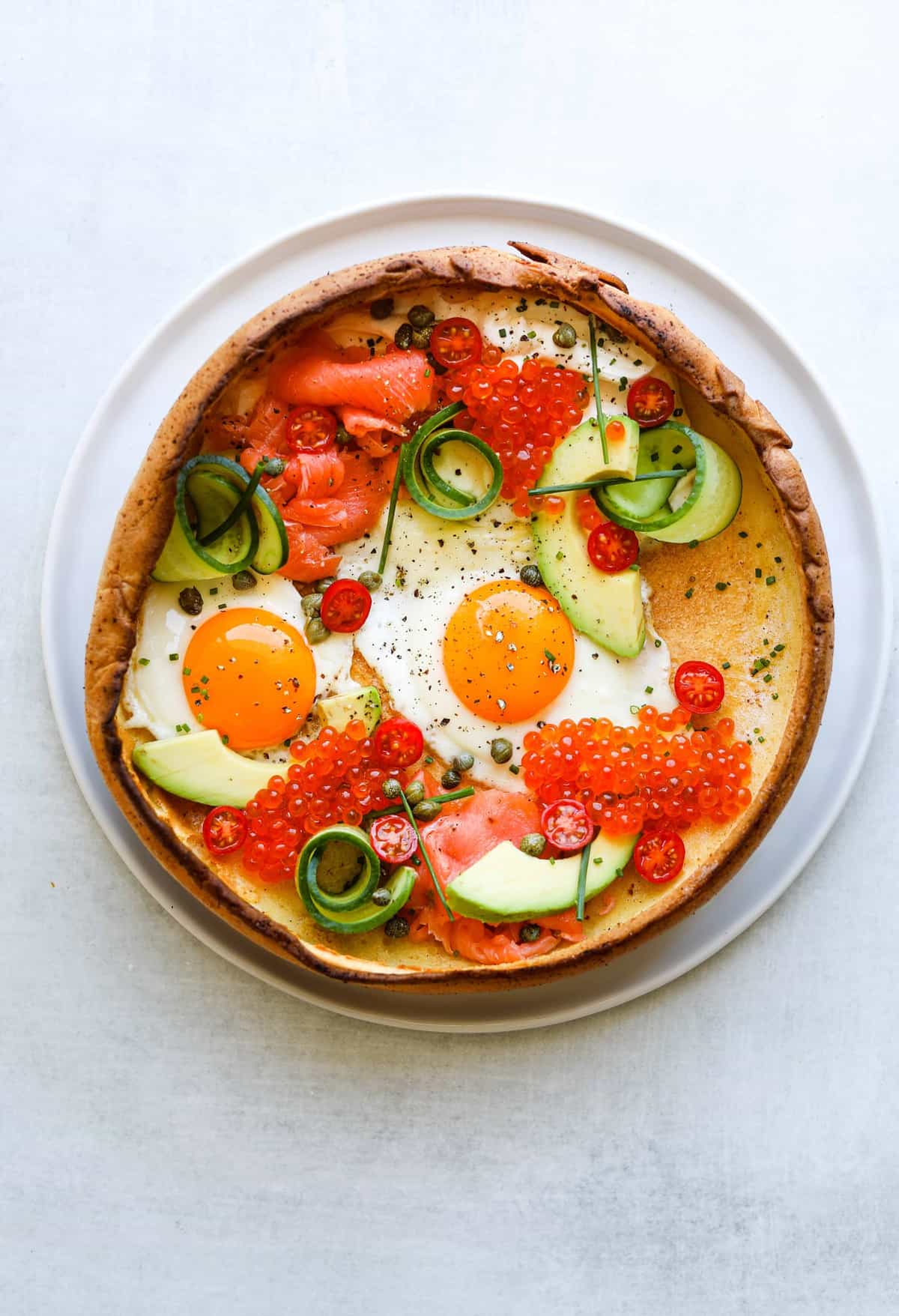 Savory Smoked Salmon Dutch Baby on a white plate