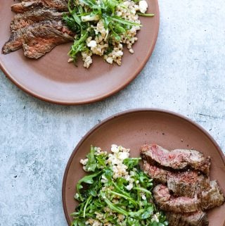 Two Plates of Five-Ingredient Steak Salad with Farro, Arugula, and Feta