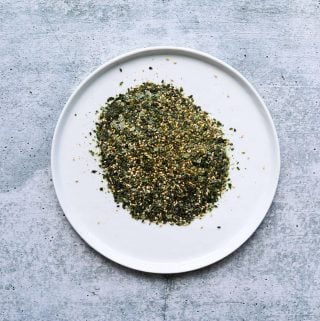 a white plate with furikake seasoning on it