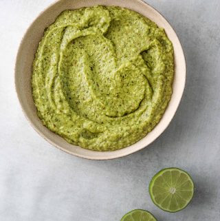creamy avocado salsa in a white bowl