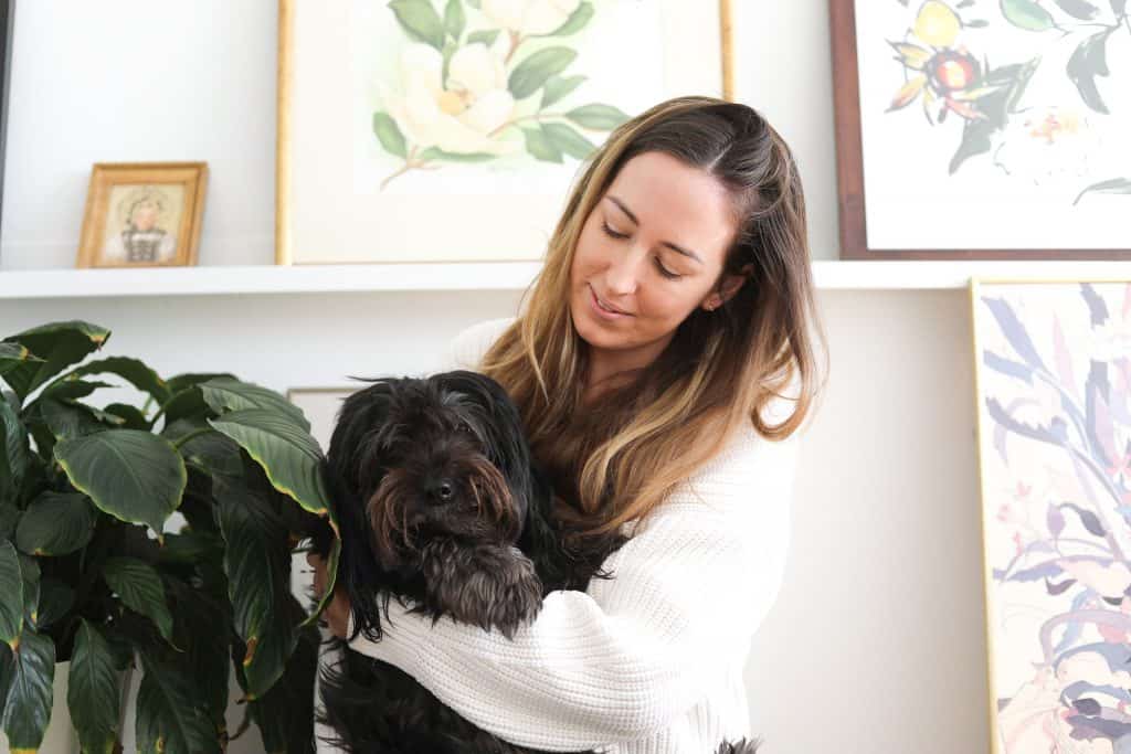 a photo of chef Leigh Anderson holding her dog Theo