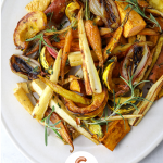 Maple and Cumin Roasted Root Vegetables on an oval serving platter