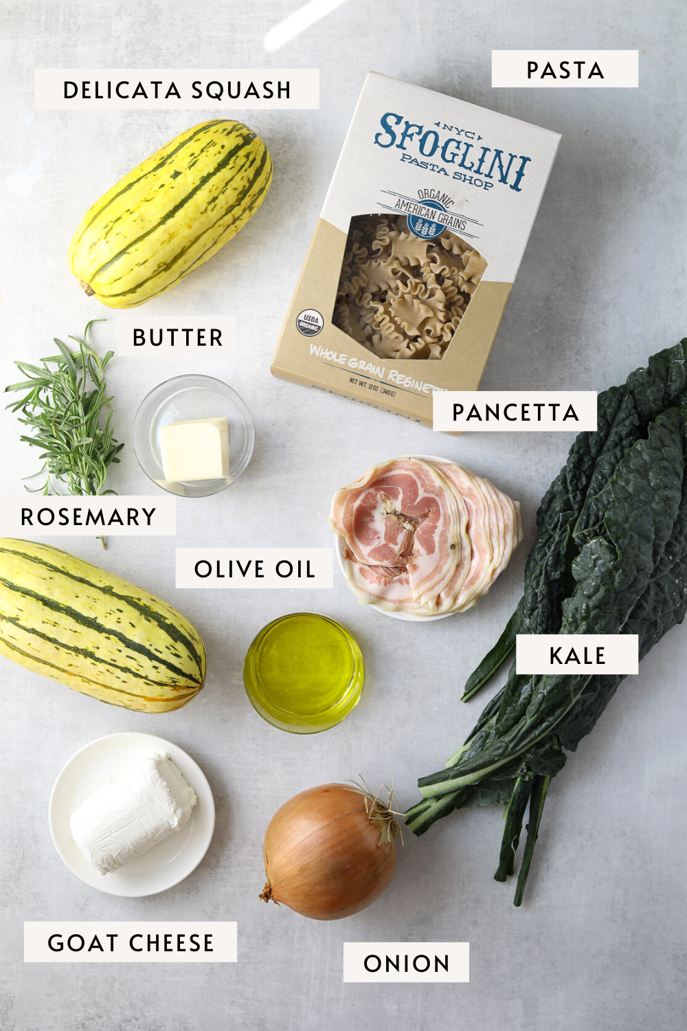 a box of pasta, two delicata squash, a bunch of kale, sliced panetta, rosemary and butter
