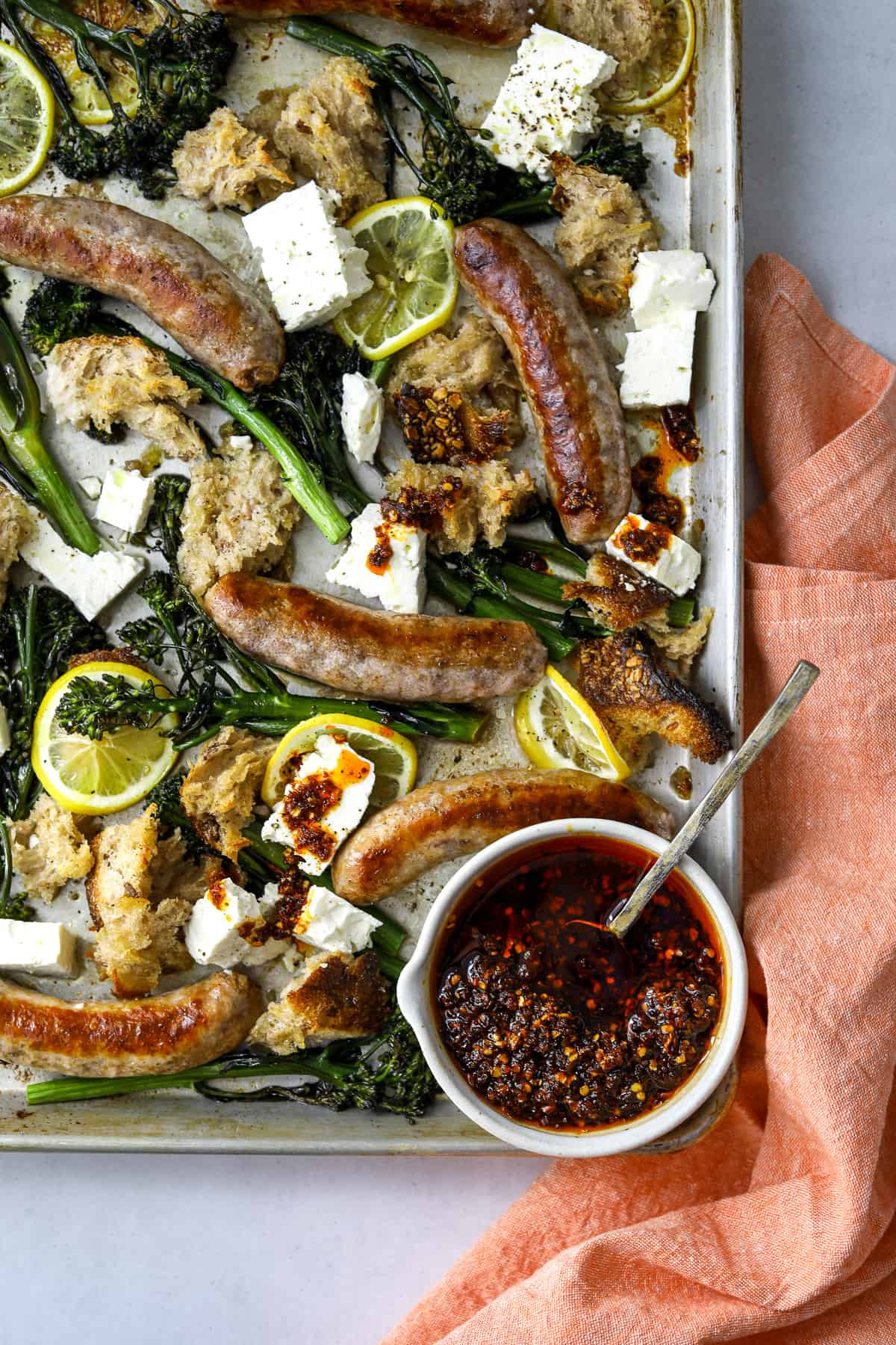 Balsamic-glazed sheet-pan sausage, fennel, and baby broccoli