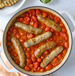 tomatoes and sausages in a pot