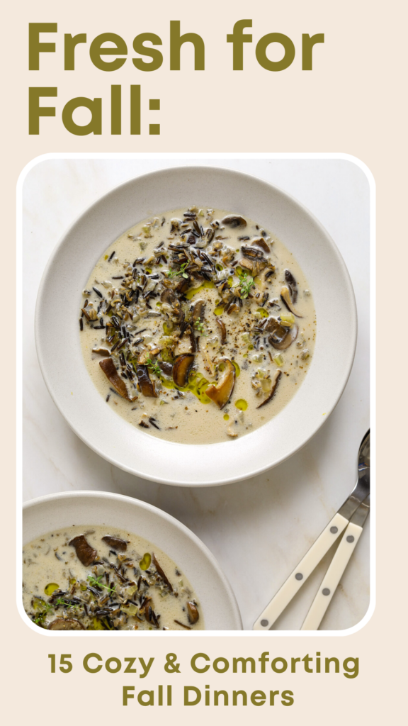 A white bowl of wild rice and mushroom soup topped with a drizzle of olive oil.